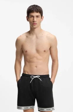 Badeshorts aus Mesh mit Jacquard-Logo-Tape
