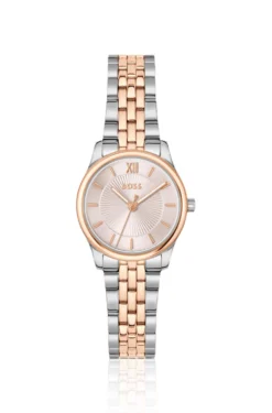Elegante zweifarbige Uhr mit rosafarbenem Zifferblatt im Sonnenschliff