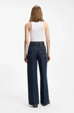 Jeans aus blauem Denim mit weitem Beinverlauf und Bundfalten auf der Vorderseite