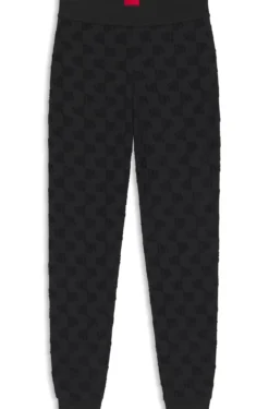 Jogginghose aus Baumwoll-Mix mit Allover-Logo-Muster