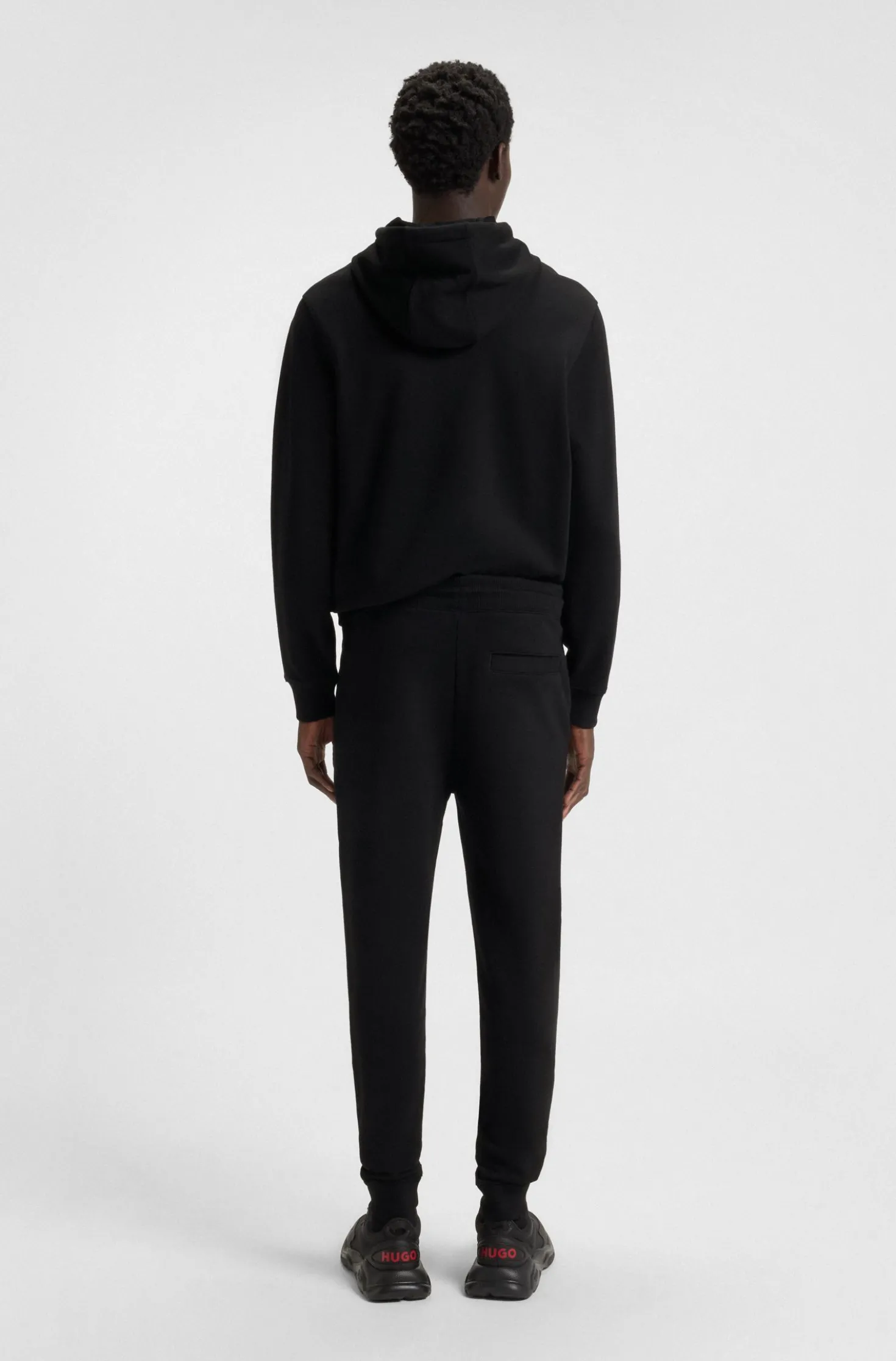 Jogginghose aus Baumwoll-Terry mit rotem Logo-Label