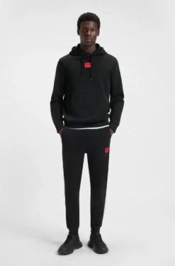 Jogginghose aus Baumwoll-Terry mit rotem Logo-Label