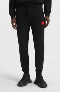 Jogginghose aus Baumwoll-Terry mit rotem Logo-Label