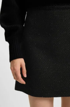 Minirock aus glitzerndem Bouclé mit Ketten-Tape