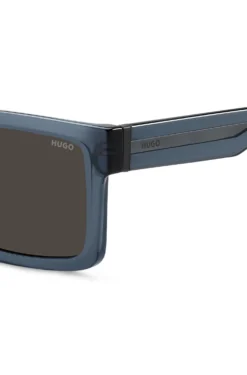 Transparent-blaue Sonnenbrille mit grauen Gläsern